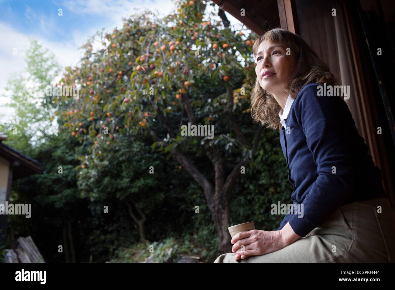 Old woman in profile sitting hi-res stock photography and images - Alamy