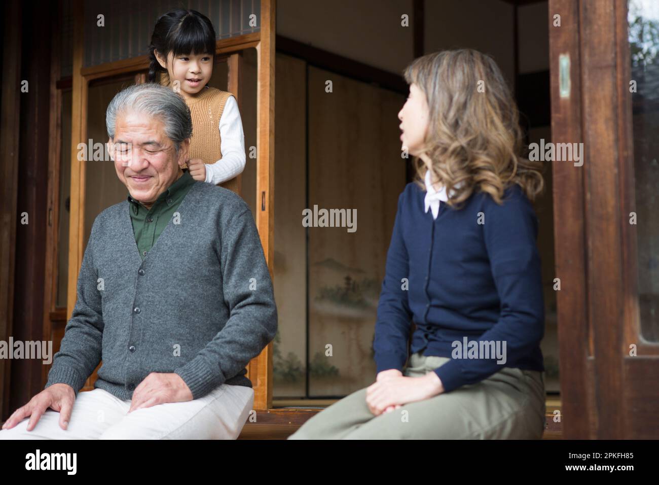 A senior couple and their grandchildren in a country house Stock Photo