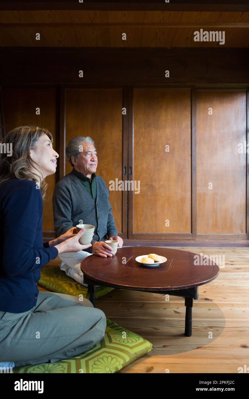 Family relaxing in country house hi-res stock photography and images ...