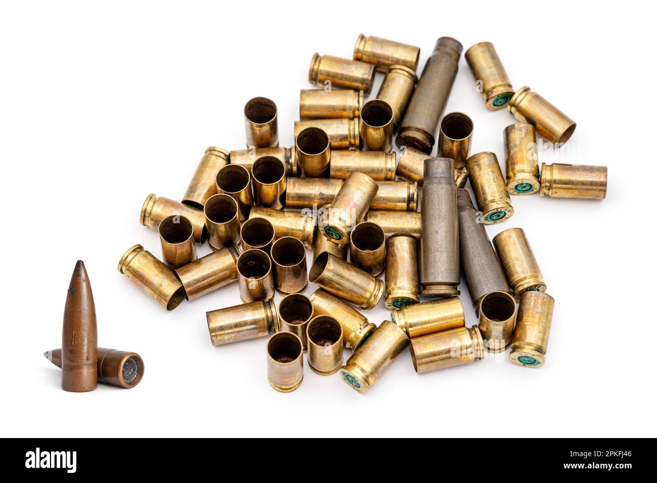 7.62 caliber bullet and bullet cartridges casings on white background