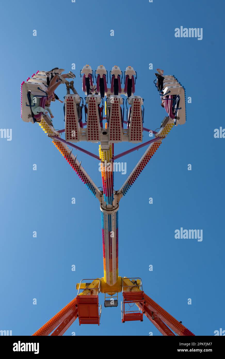 Tornado against a plain blue sky, new ride at Clarence pier funfair in Portsmouth, England. April 2023 Stock Photo