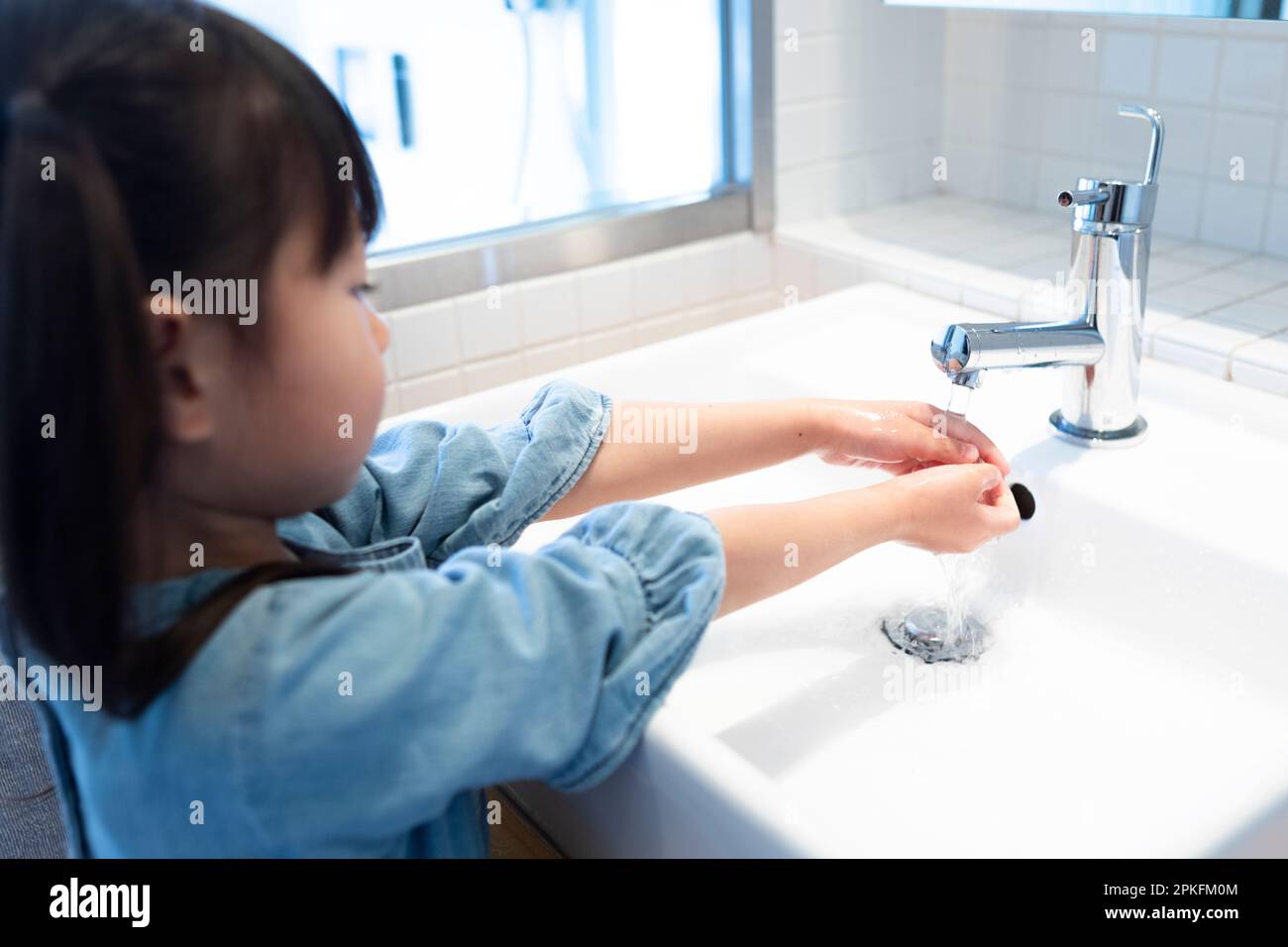 Girl Washing Hands Stock Photo