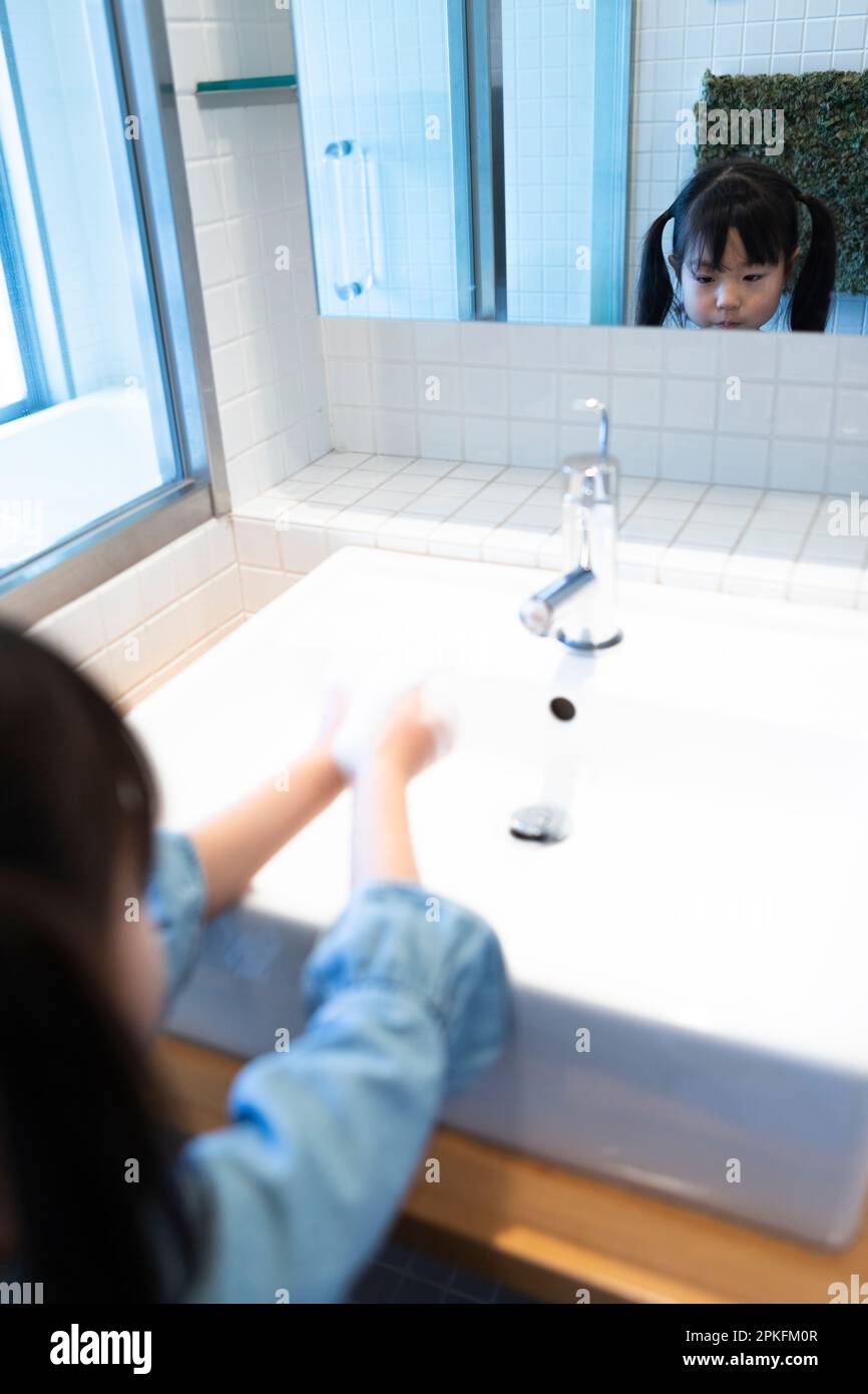 girl washing hands Stock Photo