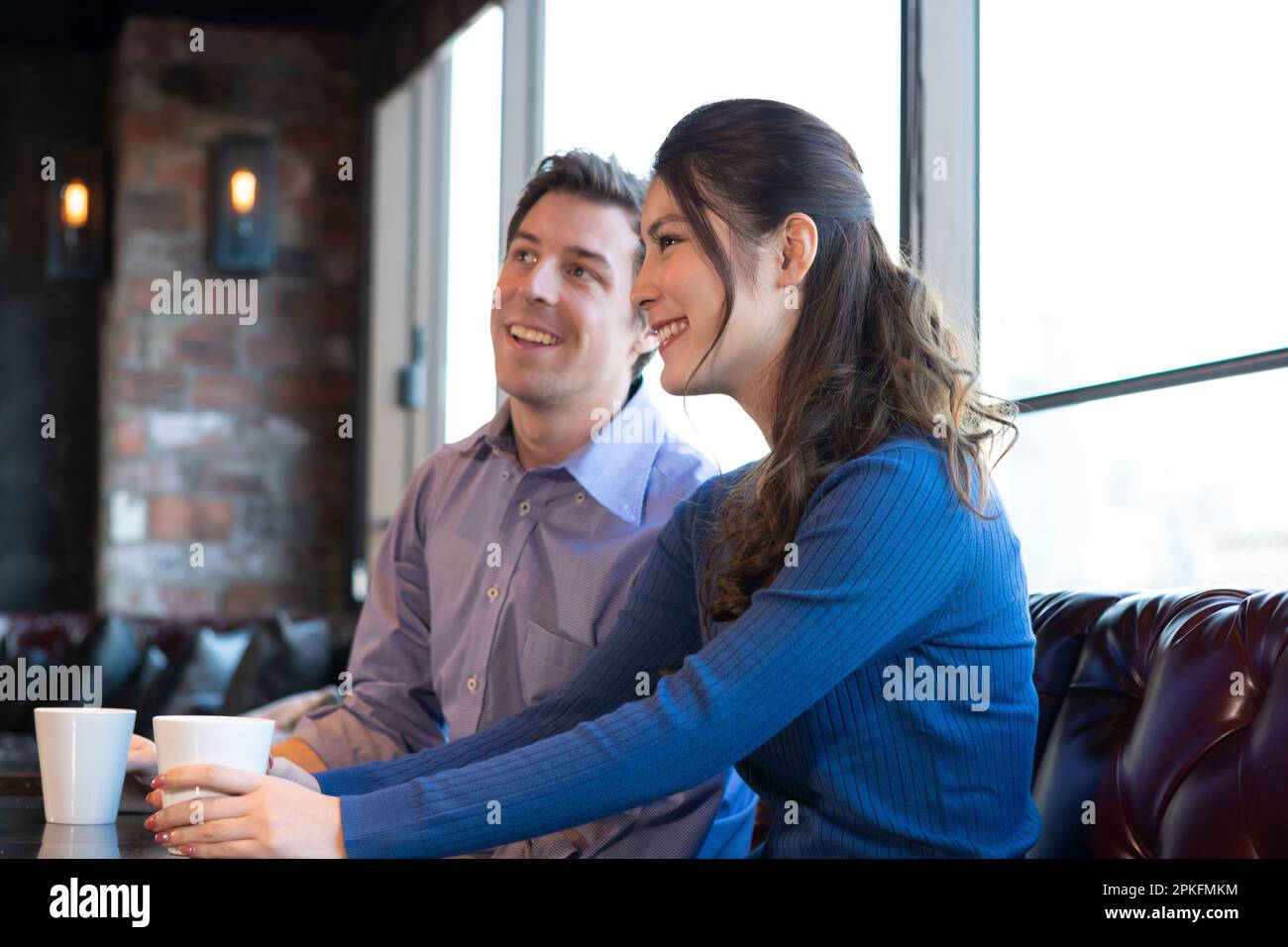 Brown couple at cafe hi-res stock photography and images - Alamy