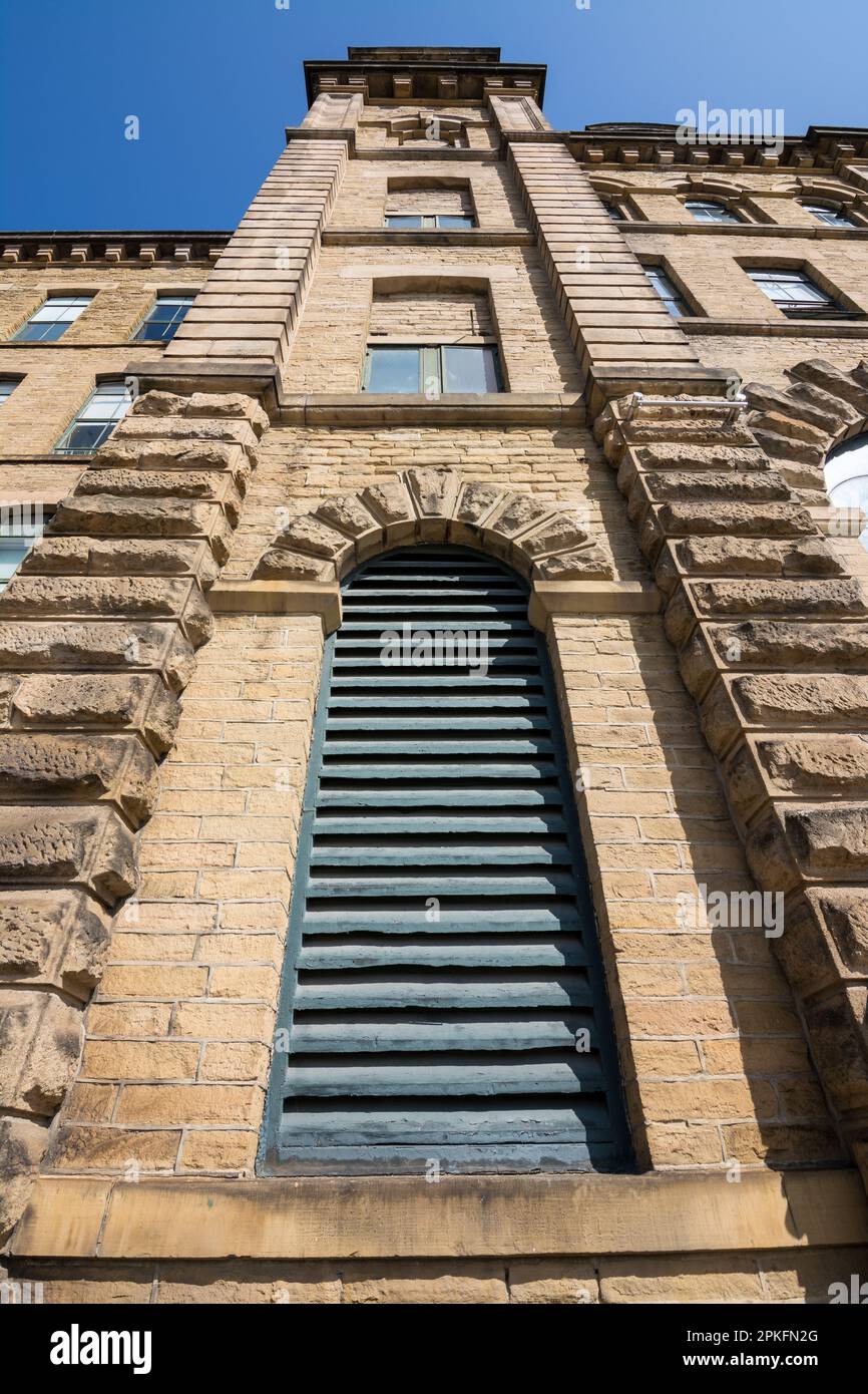 A large ventilation louvre or slatted window at Slats Mill, Saltaire, Yorkshire Dales; the starting point of the Dales High Way long distance walk. Stock Photo