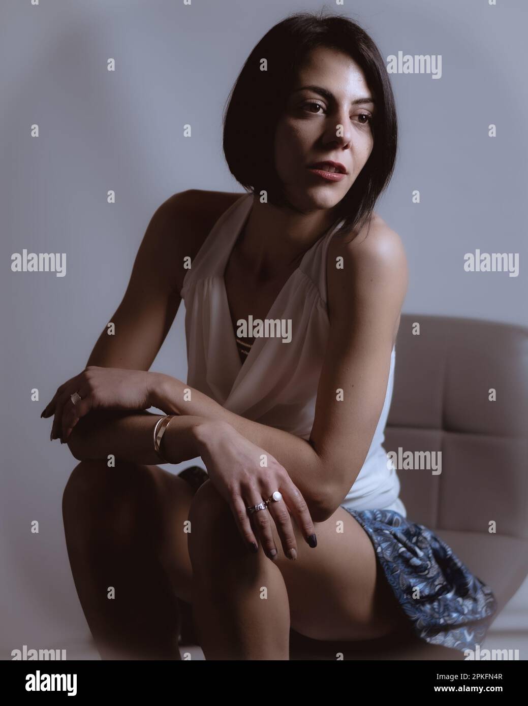 Female legs in a mini skirt hi-res stock photography and images - Alamy