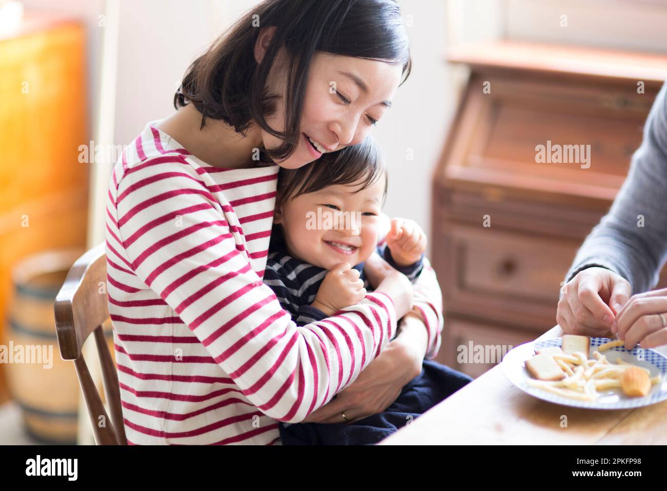 Family eating a snack Stock Photo Alamy