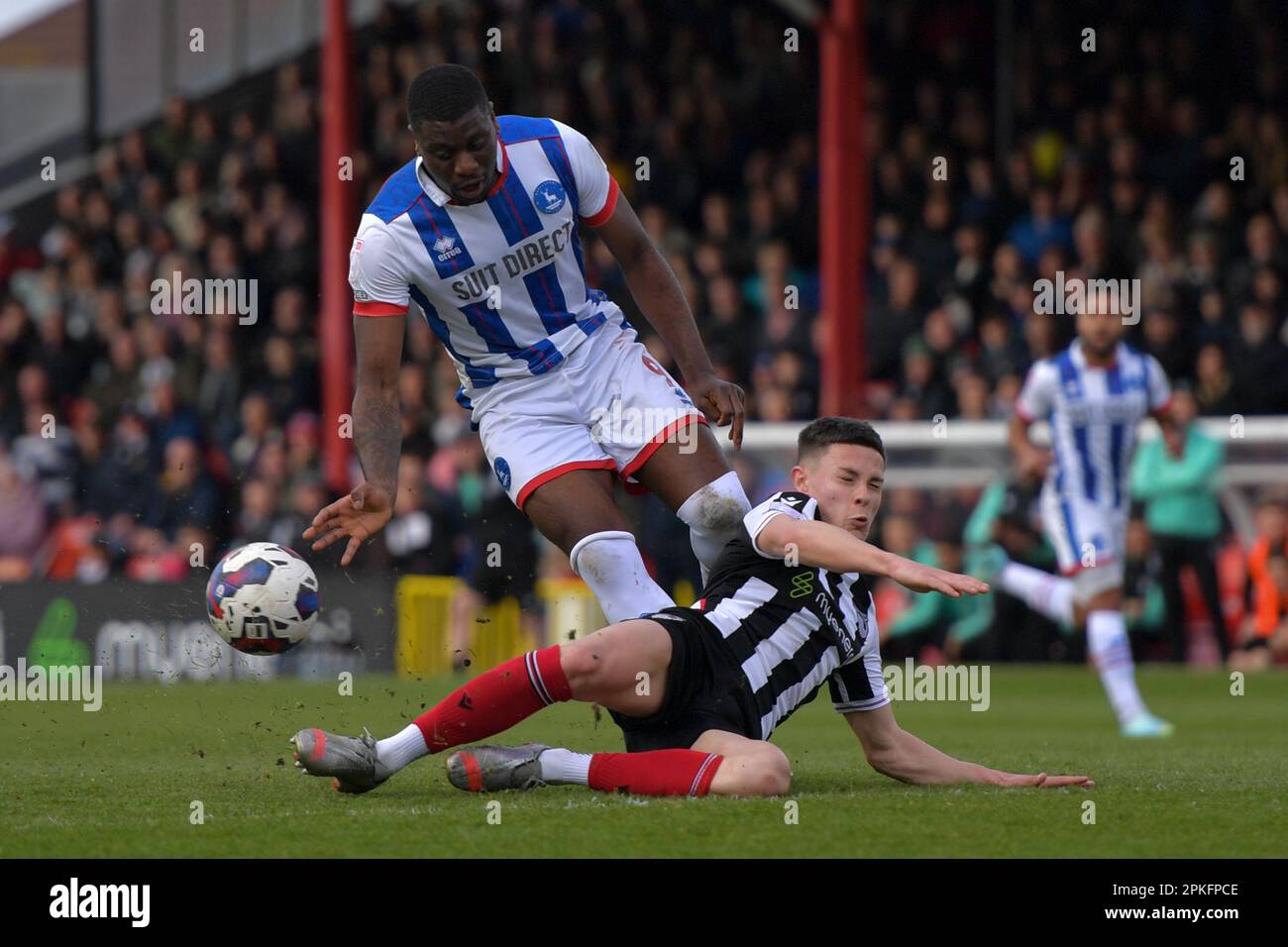 Cleethorpes, UK. 06th Apr, 2023. Grimsby Town's Alex Hunt blocks Hartlepool United's Josh Umerah on his first attempt at goal during the Sky Bet League 2 match between Grimsby Town and Hartlepool United at Blundell Park, Cleethorpes on Friday 7th April 2023. (Photo: Scott Llewellyn | MI News) Credit: MI News & Sport /Alamy Live News Stock Photo