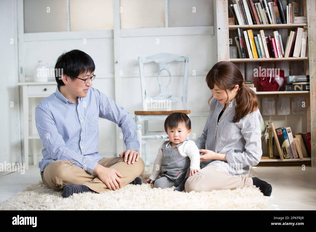 Family relaxing in the living room Stock Photo