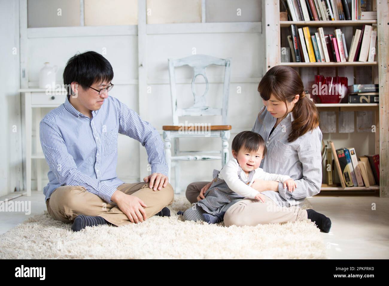 A couple feeding their baby Stock Photo