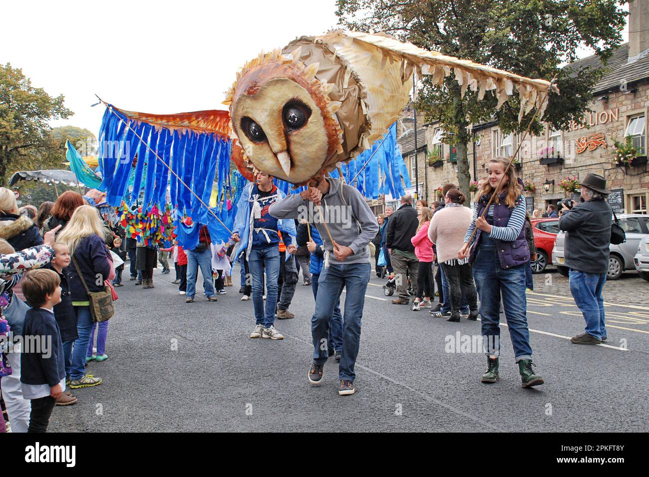 Giant birds, including an owl, featured in the street parade at the Skipton Puppet Festival 2015. Stock Photo