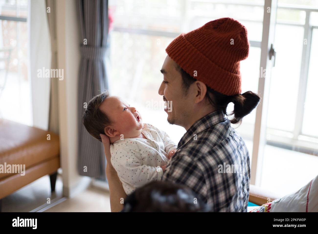 A father holding his baby Stock Photo