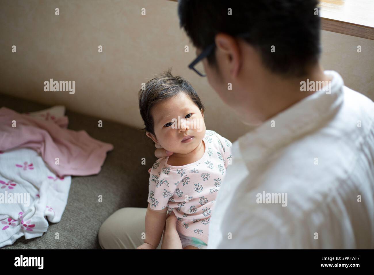 Father holding baby Stock Photo