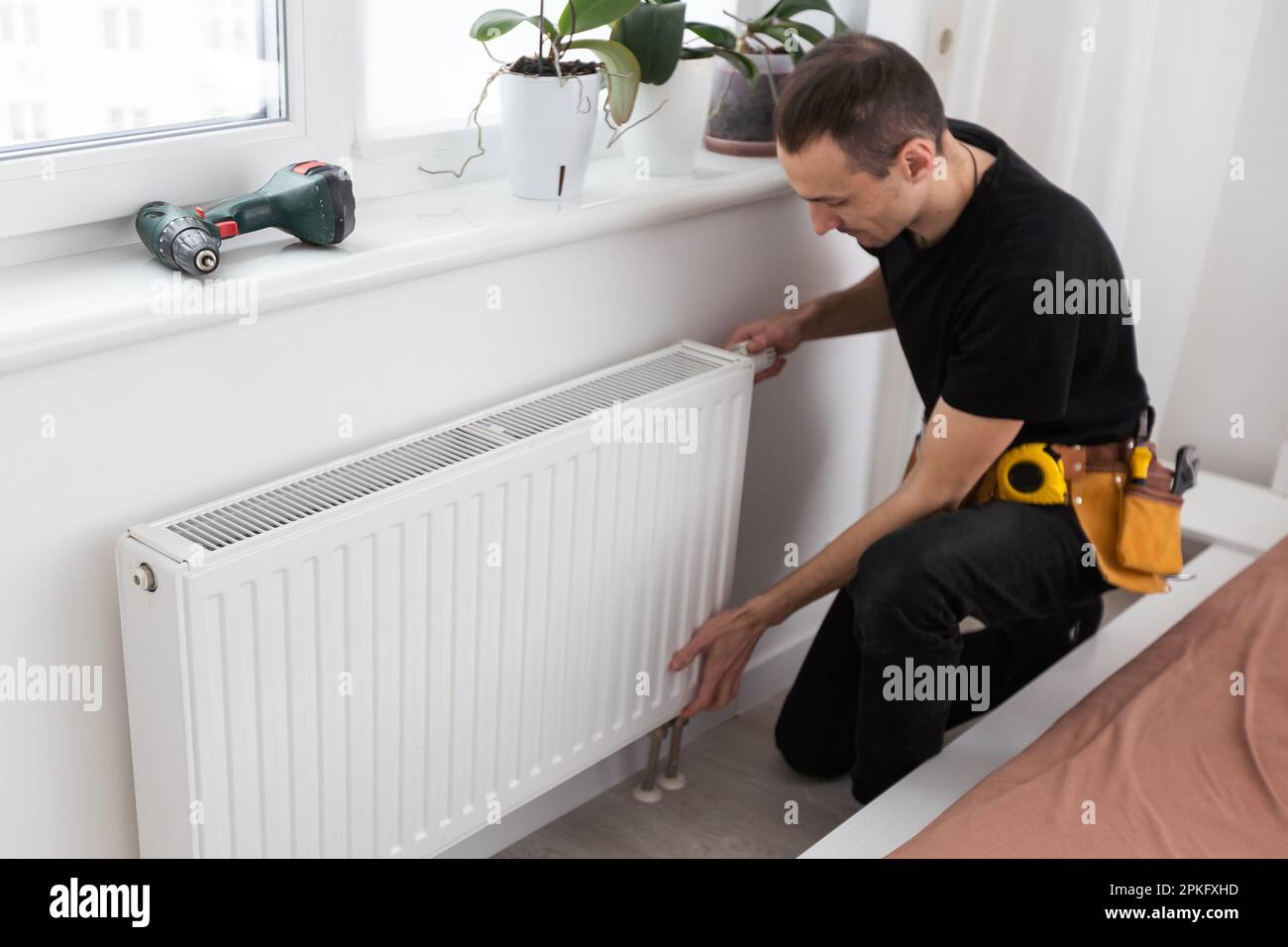 The process of installing a battery to water pipes. Heating system