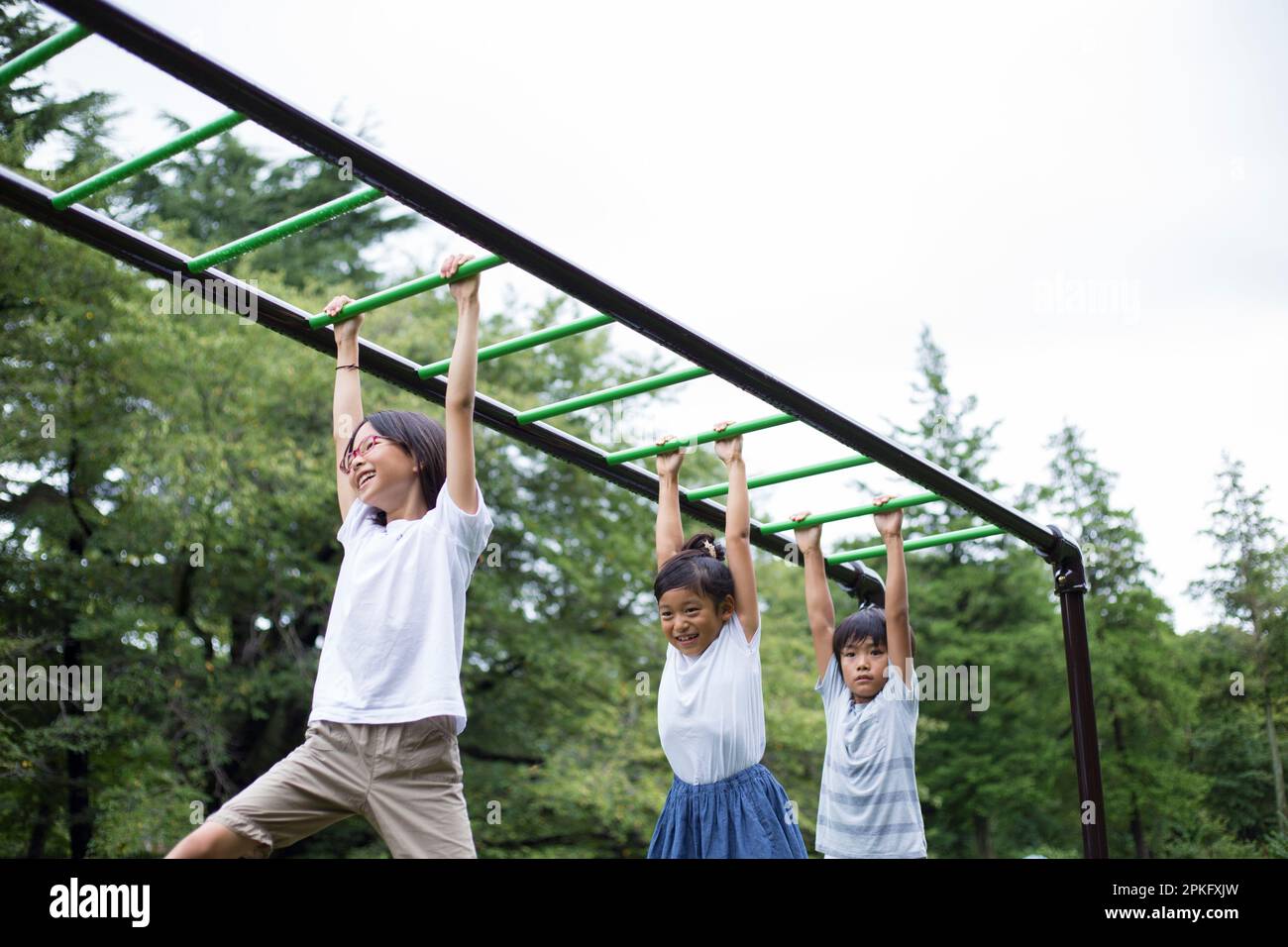 Elementary school children doing cartwheels Stock Photo