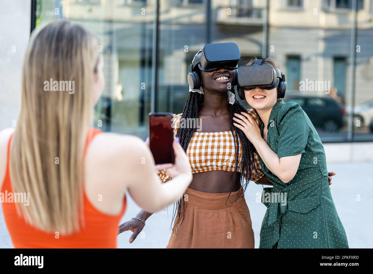 Young multiracial girls using futuristic virtual reality headset