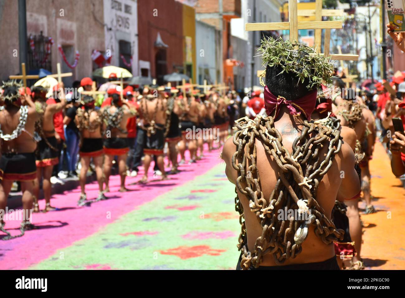Atlixco, Mexico. 7th Apr, 2023. Hooded Penitents, wearing heavy chains ...