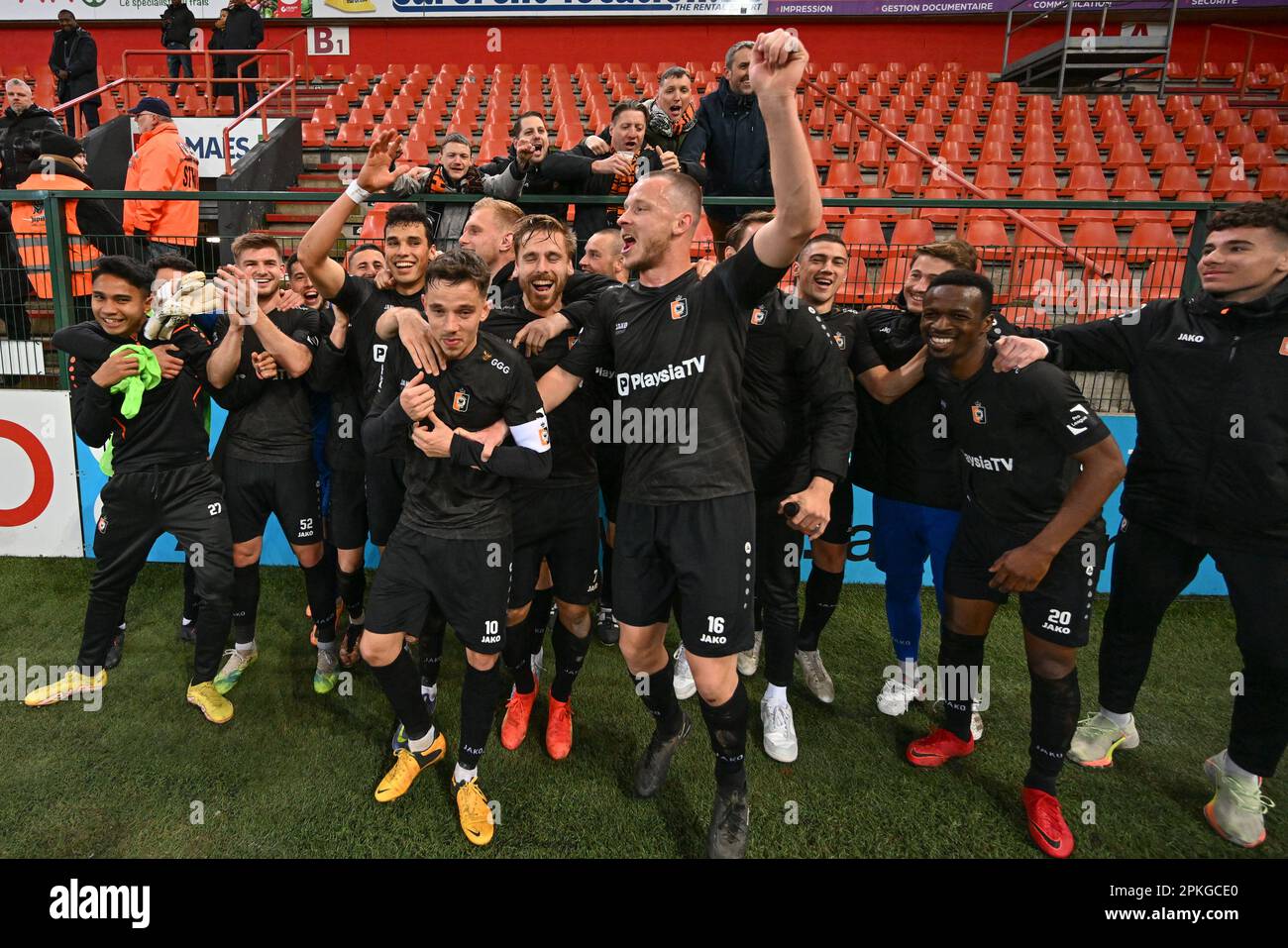 players of Deinze pictured celebrating after winning a soccer game