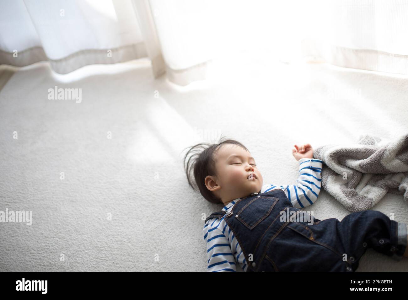 Baby sleeping in living room Stock Photo Alamy