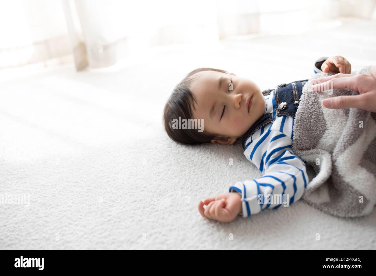 Mother napping with napping baby Stock Photo