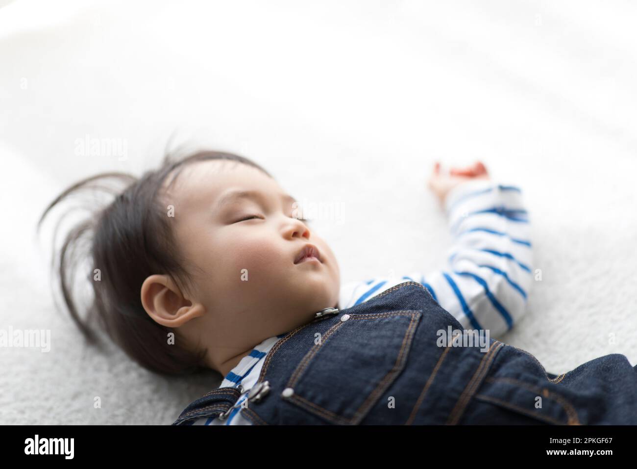 Baby sleeping in living room Stock Photo Alamy