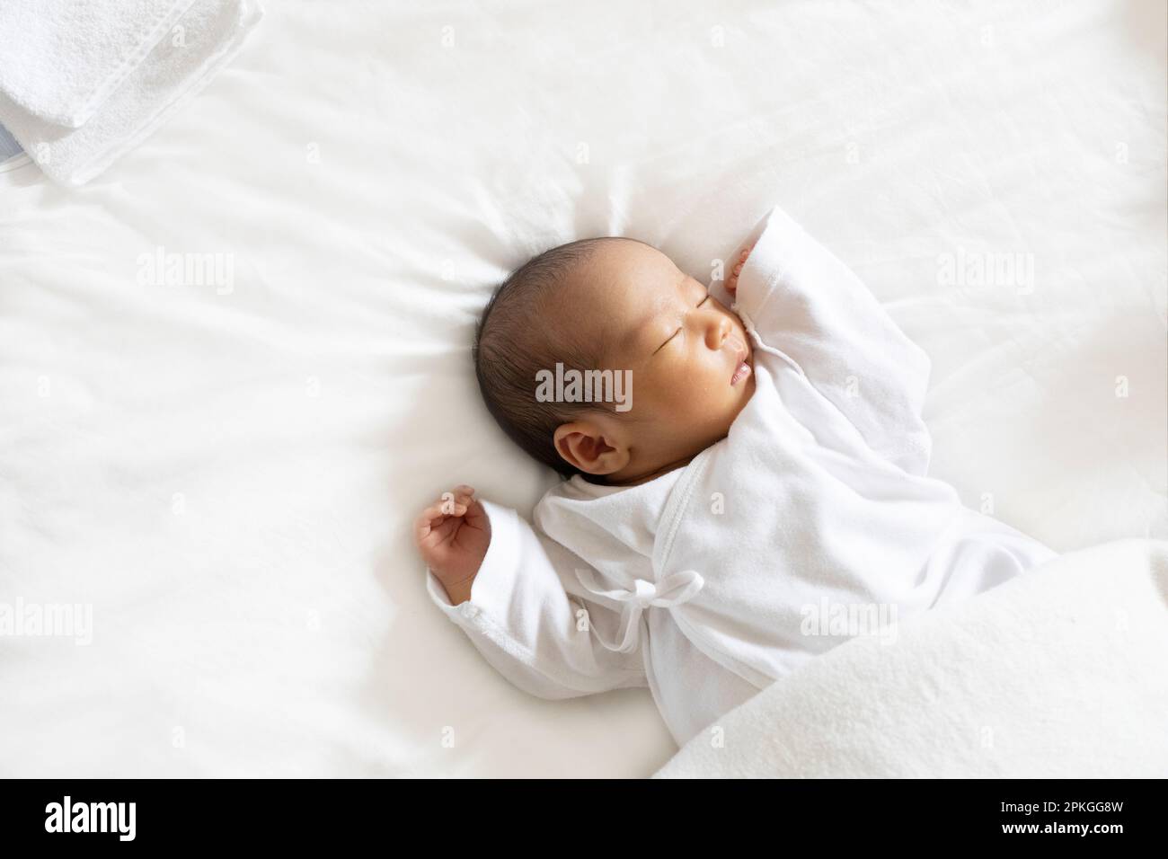 Newborn asian baby girl sleeping hi-res stock photography and