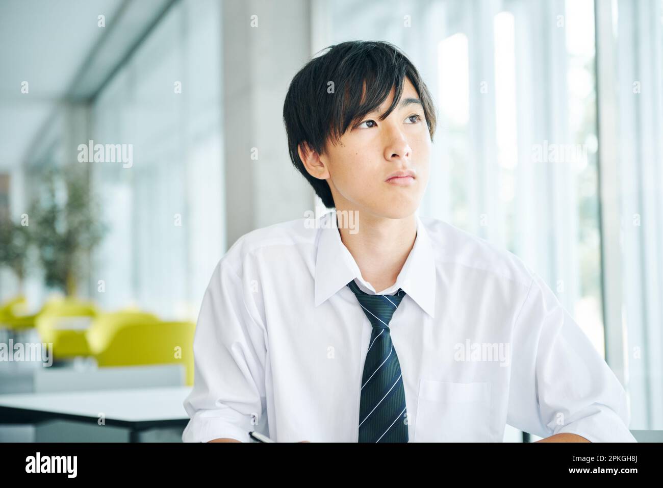 A high school boy taking a class at a cram school Stock Photo