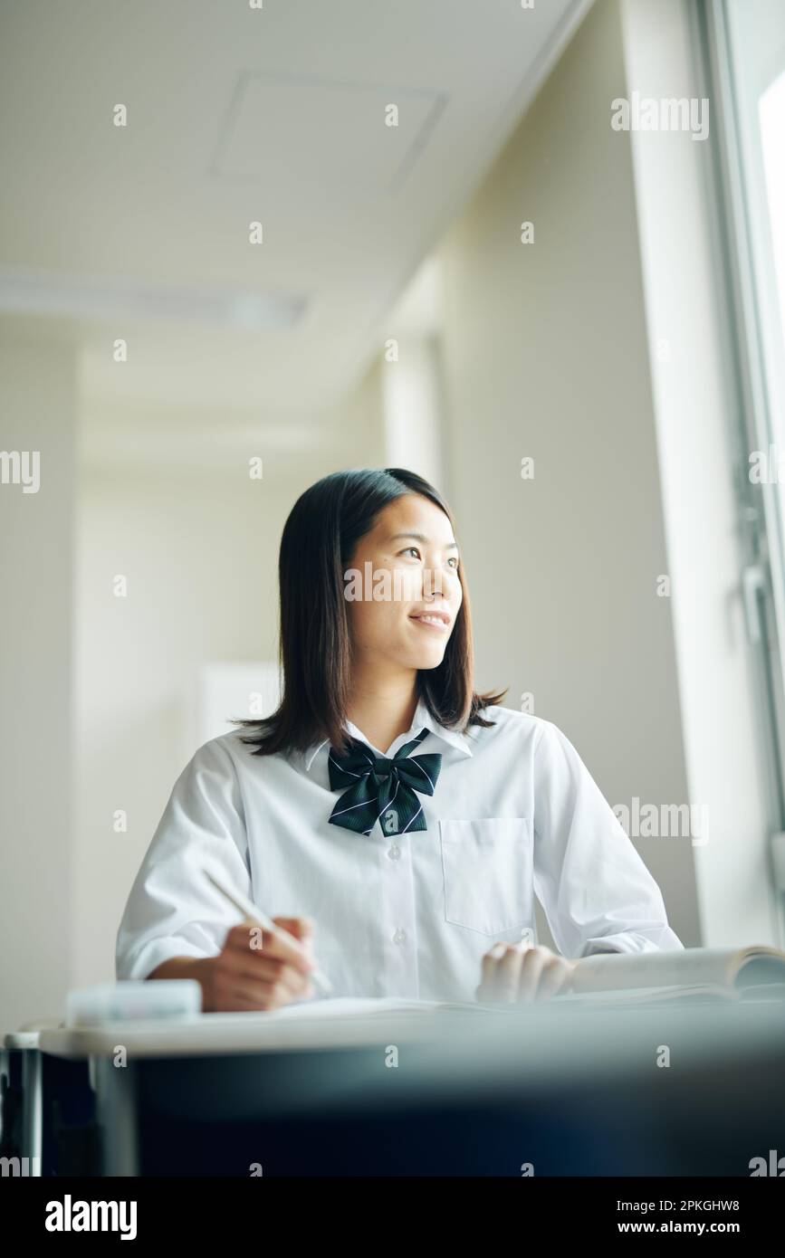High school girls studying in a classroom Stock Photo - Alamy