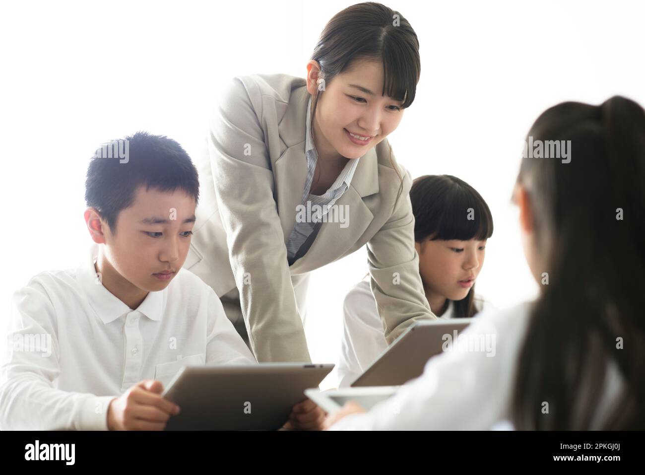 Teacher Teaching Programming to Elementary School Students AR Stock ...