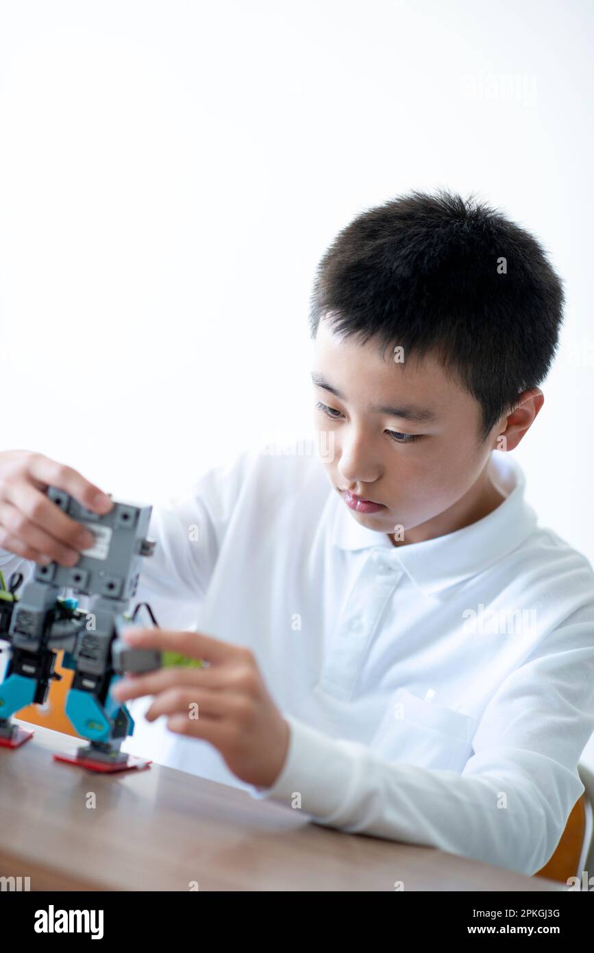 Elementary school students studying programming Stock Photo