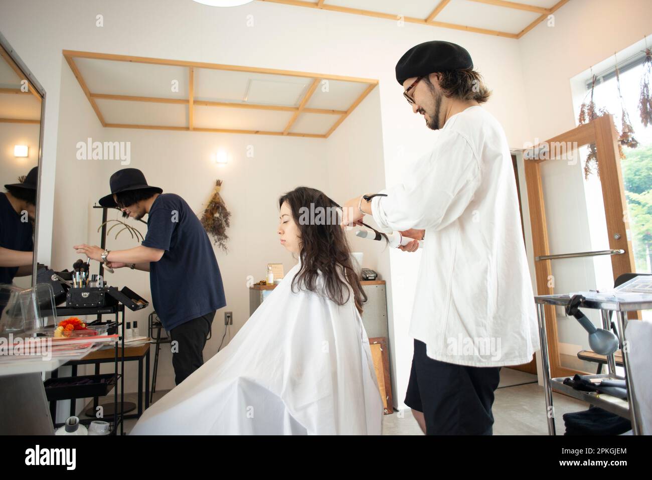 Woman having hairdresser do her hair Stock Photo