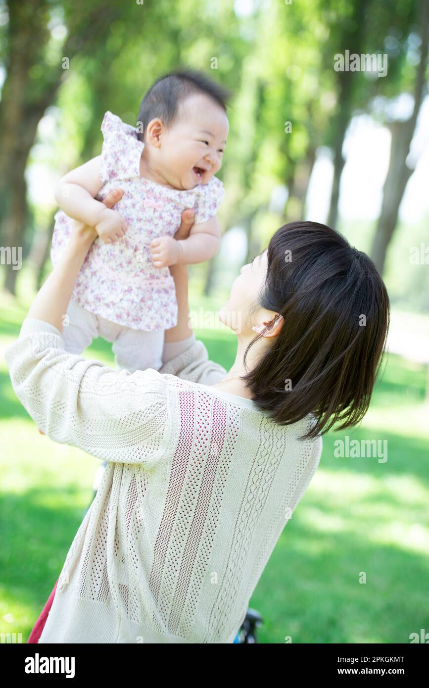 Mother feeding baby Stock Photo - Alamy