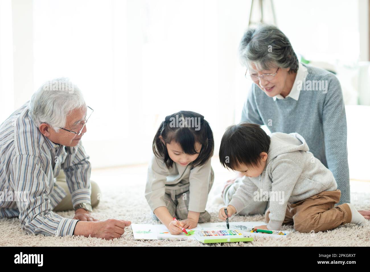 Grandparents and grandchildren drawing Stock Photo