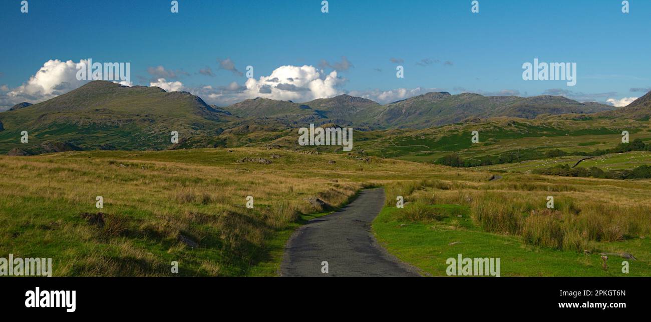 Road to the green hills Stock Photo