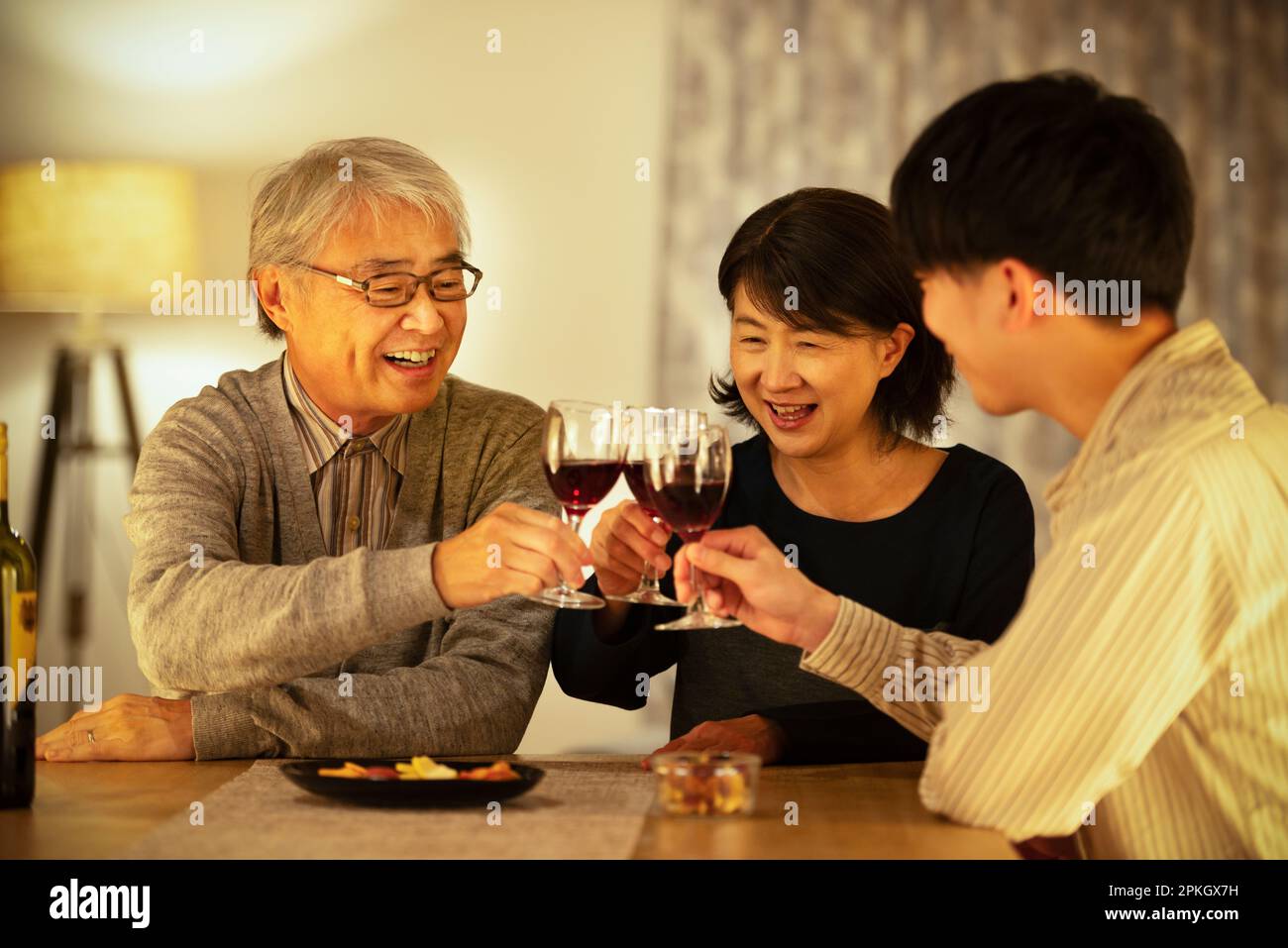 Parent and child toasting wine Stock Photo Alamy
