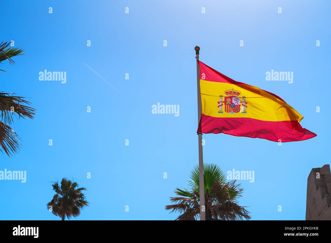 large spanish flag against the sky Stock Photo