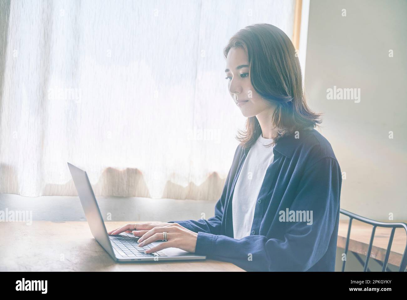 Woman operating laptop hi-res stock photography and images - Alamy