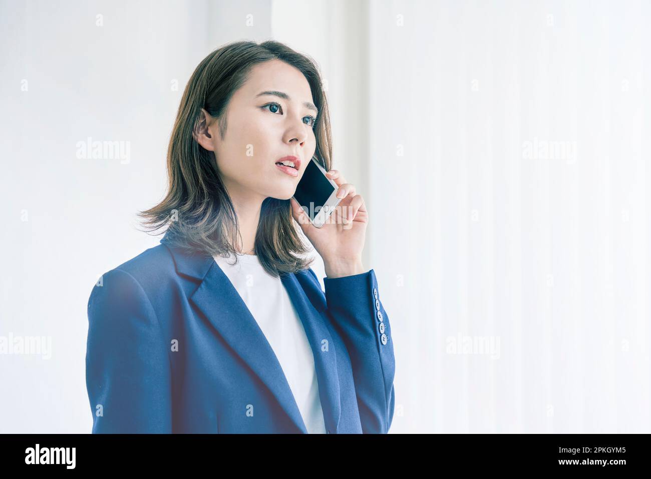 Woman talking on smartphone Stock Photo