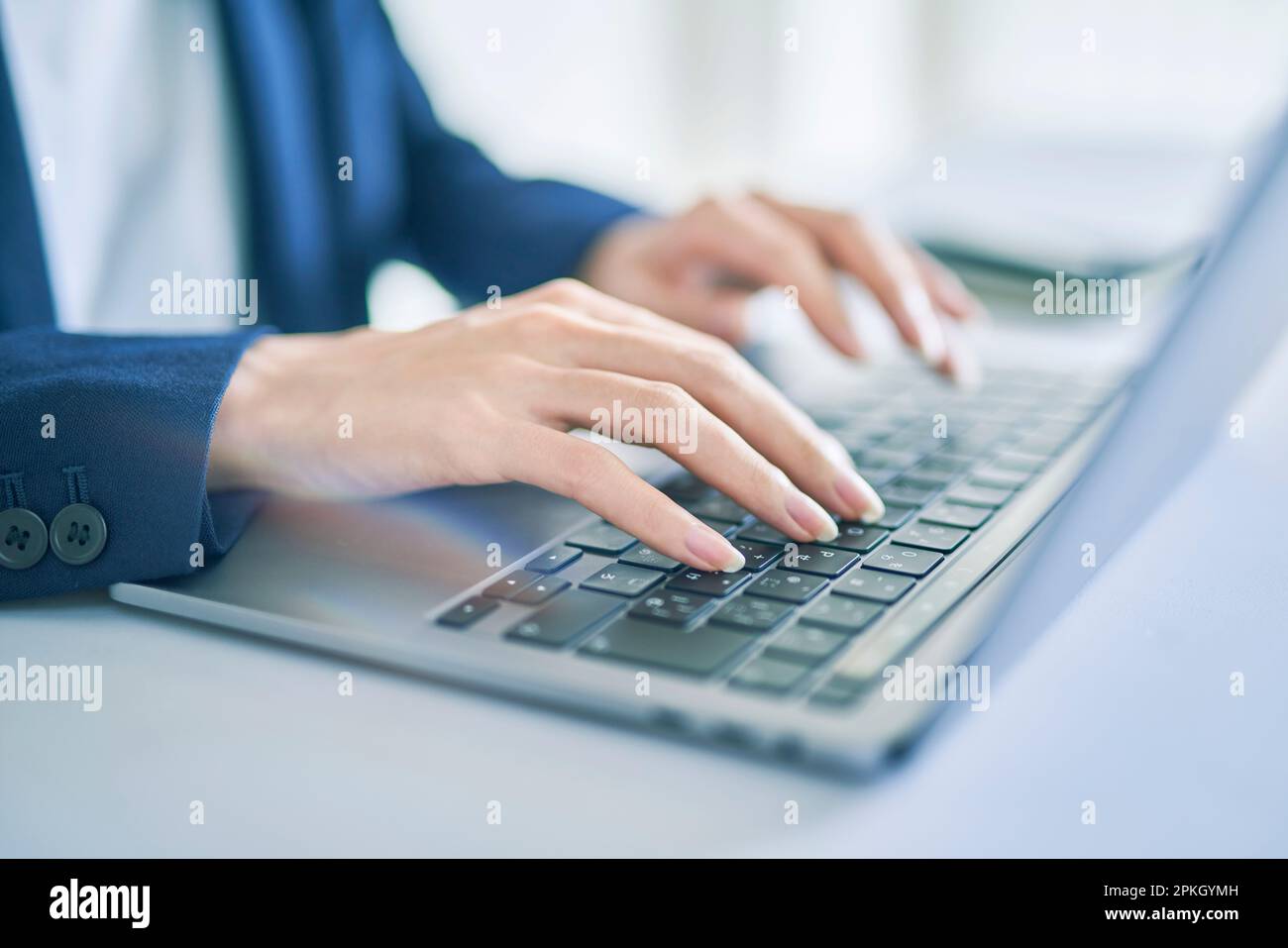 Woman operating a computer Stock Photo