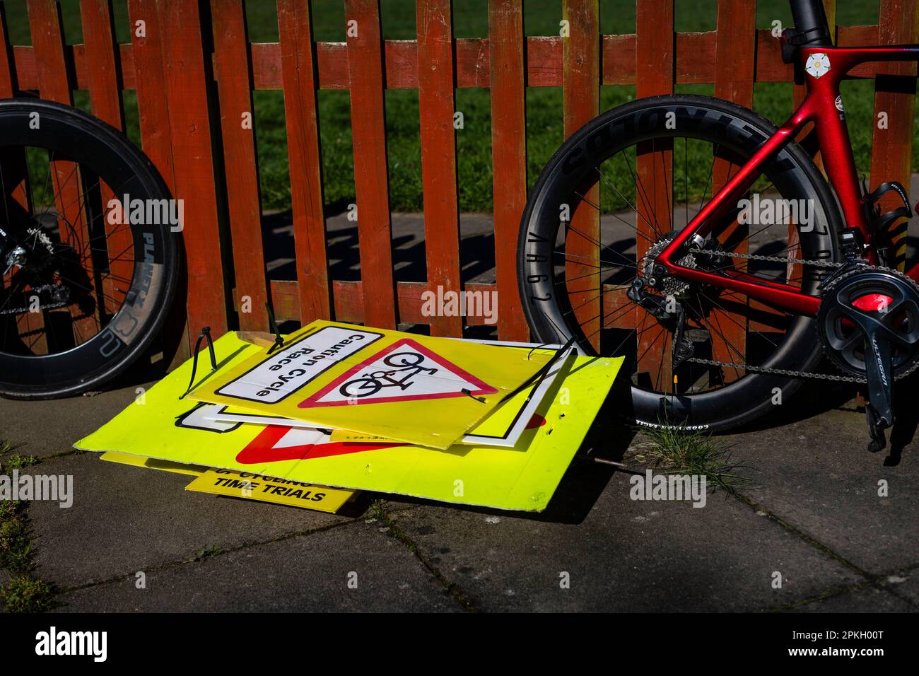 Close-up of signage and bicycles, warning signs for TT bike race., Stock Photo