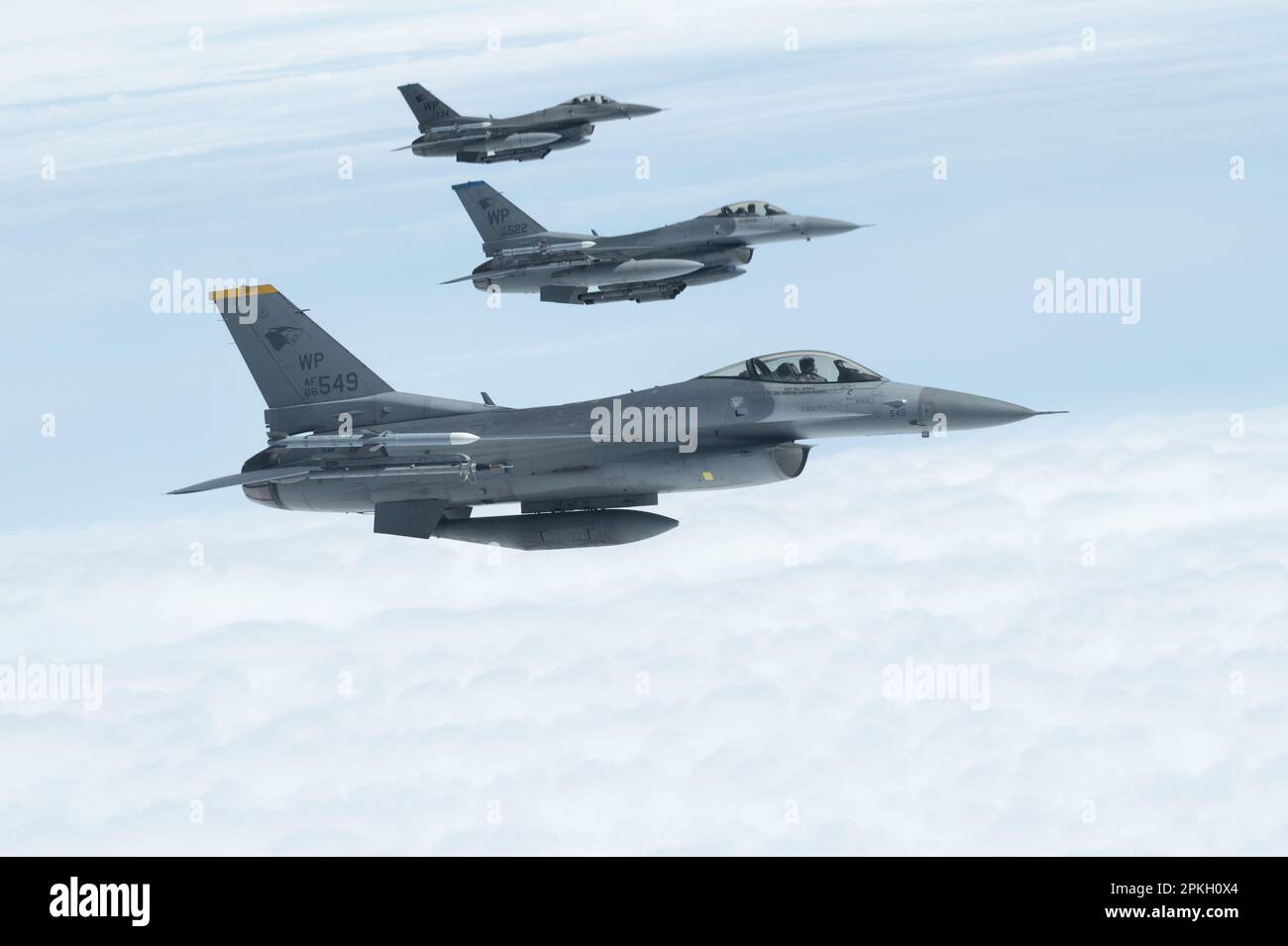 U.S. Air Force F-16 Fighting Falcons assigned to the 8th Fighter Wing, Kunsan Air Base, Republic of Korea, fly alongside a U.S. Air Force KC-135 Stratotanker assigned to the 909th Air Refueling Squadron, Kadena Air Base, Japan, over the Pacific Ocean, April 5, 2023. The U.S. is committed to denying adversarial aggression through strategic airpower aimed to deter and dominate aggressors in any airspace. (U.S. Air Force photo by Senior Airman Yosselin Campos) Stock Photo