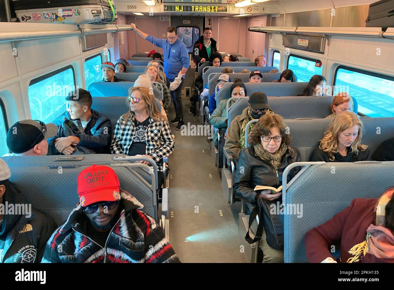 On Monday, April 3, 2023, people ride a New Jersey Transit train in