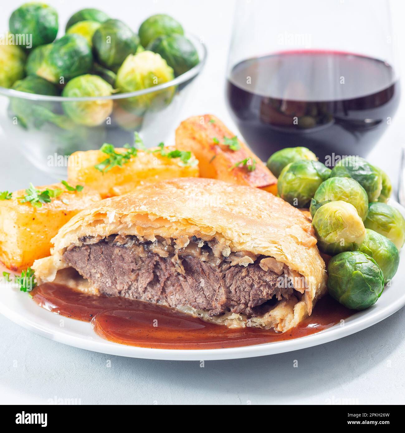 Plate with Beef Wellington and mushroom Duxelles, served with brussels ...
