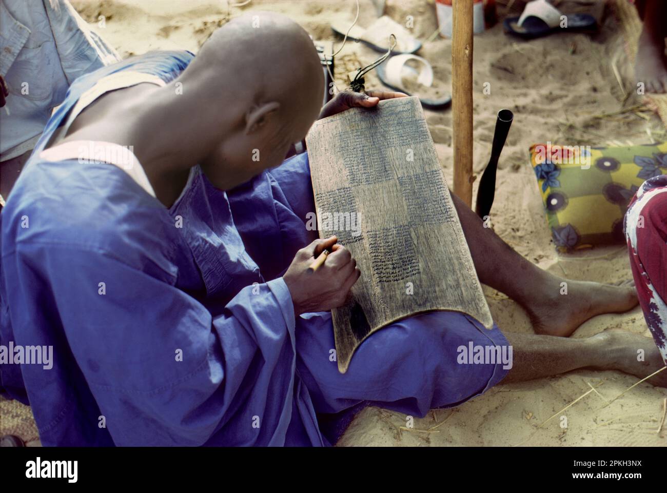Africa, Chad, Sahel region, Islands of Lake Chad: Kanembu man studying 