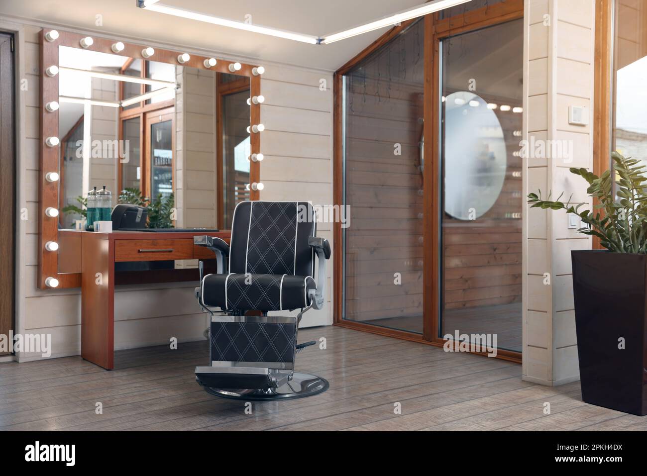 Hairdressing salon interior with large mirror and chair Stock Photo Alamy