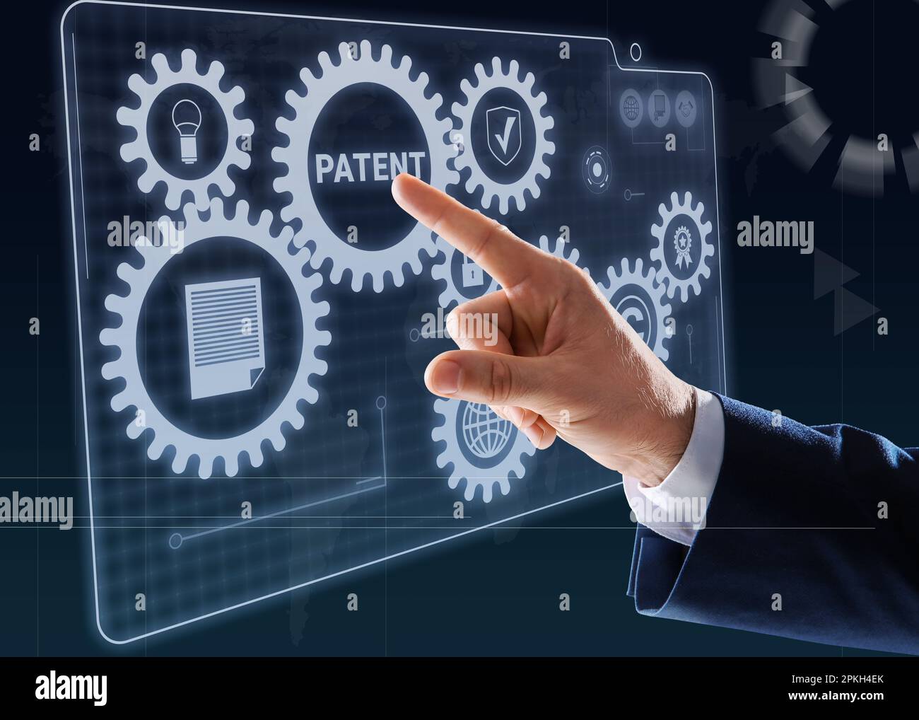 Patent concept. Man pressing button on virtual screen, closeup Stock Photo