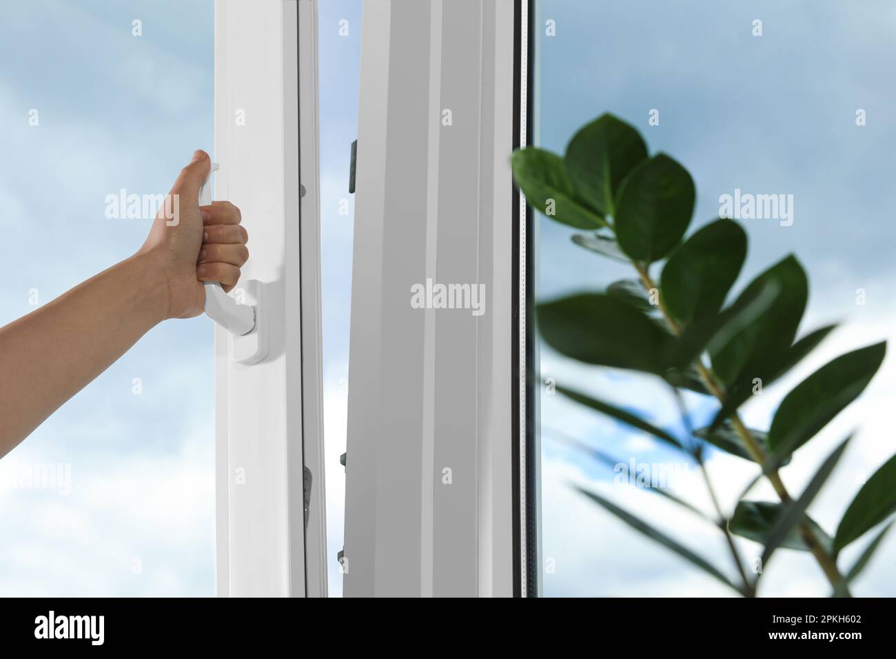 Woman open white plastic window hi-res stock photography and images - Alamy