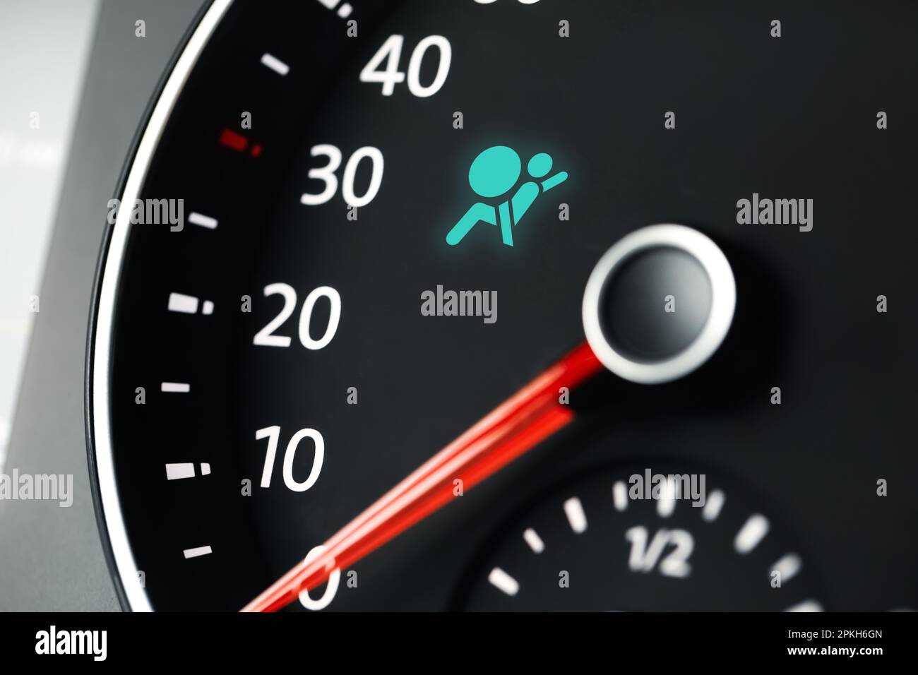 Closeup view of dashboard with warning icon check airbag system in car