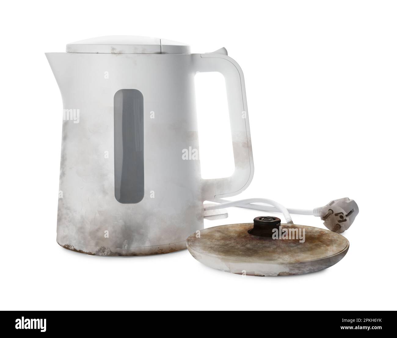 Burnt electric kettle with base and plug on white background Stock