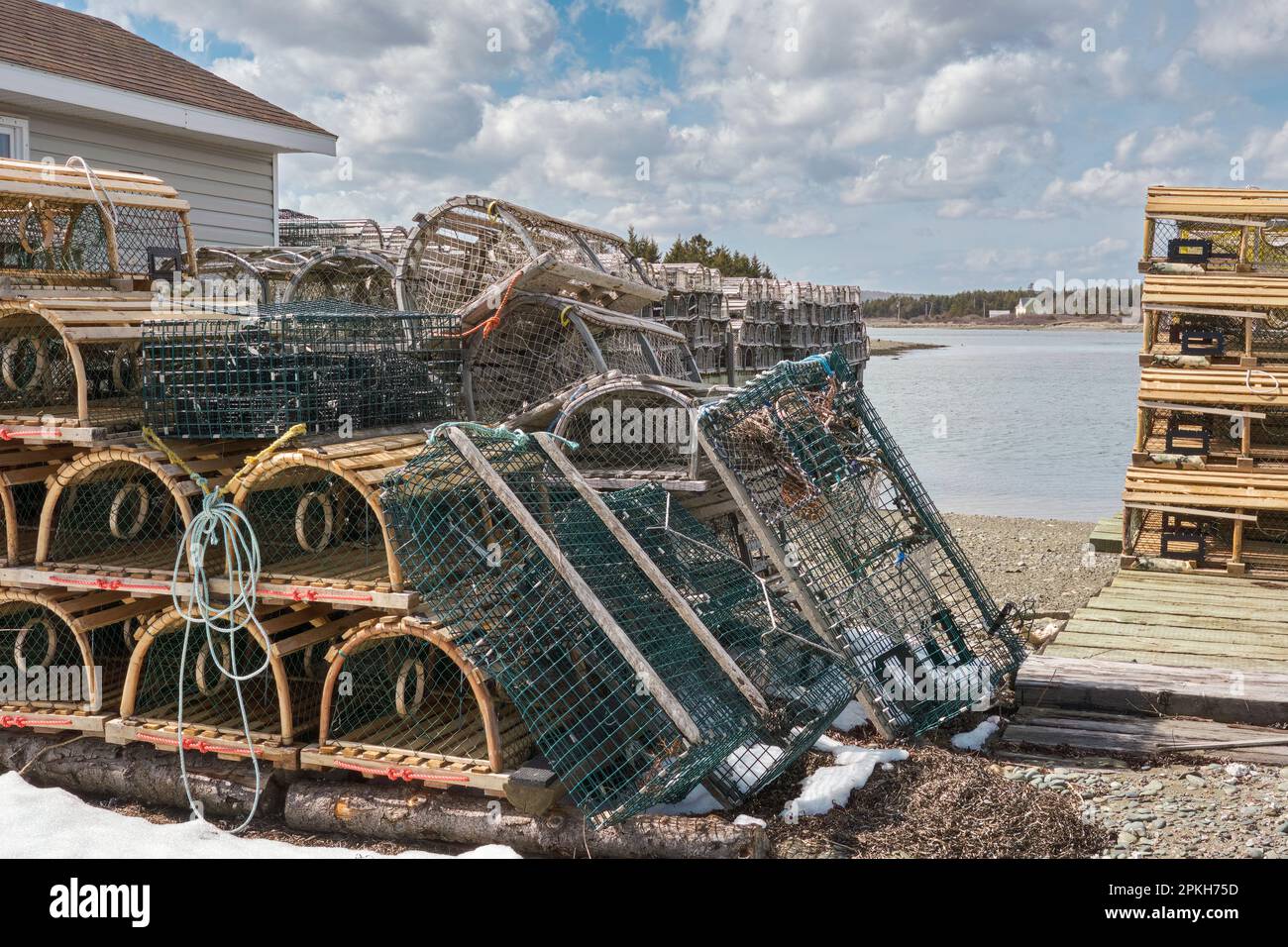 Lobster traps or pots ready for the spring lobster fishing season at Gabarus Nova Scotia. Stock Photo